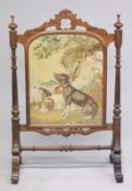 A GOOD VICTORIAN MAHOGANY FIRE SCREEN with a Brussels needlework panel of two dogs, with glazed
