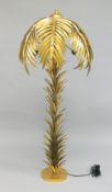 A FLOOR STANDING LAMP modelled as a gilt metal palm tree. 5ft 3ins high.