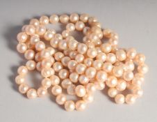 A STRING OF PINK PEARLS.