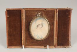 A GEORGIAN LEATHER CASED MINIATURE OF A LADY.