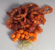 FOUR VARIOUS STRINGS OF AMBER.