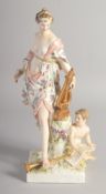 A BERLIN PORCELAIN FIGURE OF A MUSE carrying a lyre, a cupid at her feet. Mark in blue. 12ins high.