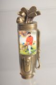 A BRASS AND ENAMEL GOLF BAG VESTA.