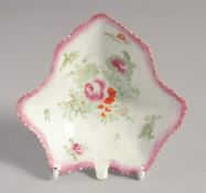 A BOW LEAF SHAPED PICKLE DISH with pink border, painted with flowers and leaves, (some decay due