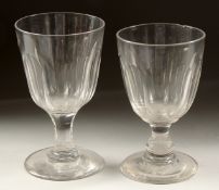 A PAIR OF FLUTED 19TH CENTURY GLASS RUMMERS on circular bases. 6ins high.