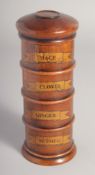 A POLISHED WOOD SPICE TOWER. 7.5ins high.