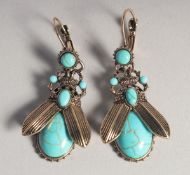 A PAIR OF TURQUOISE BUG EARRINGS.