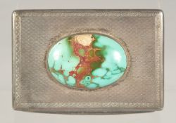 AN ENGINE TURNED SILVER SNUFF BOX with an inset stone top. (A/F) French, circa. 1900. 3.25ins x