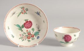 A LIVERPOOL TEA BOWL AND SAUCER painted with oriental style coloured flowers.