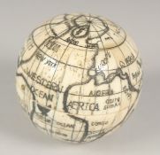 AN ETCHED BONE FOLDING COMPASS. 2.5ins diameter.