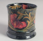 WILLIAM MOORCROFT FLORIAN WARE CACHE POT, floral design on a blue ground . Signed W. Moorcroft in