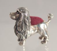 A SILVER POODLE PIN CUSHION.