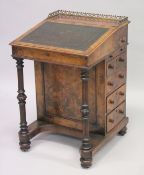 A GOOD VICTORIAN FIGURED WALNUT DAVENPORT by EDWARDS & ROBERTS with brass grill, tapering leather