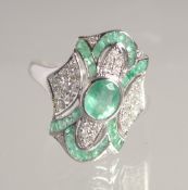 A 9CT GOLD EMERALD AND DIAMOND DECO STYLE RING.