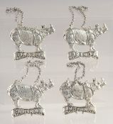 A SET OF FOUR SILVER PLATED RHINO LABELS. Sherry, Brandy, Whiskey, Claret.