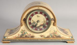 AN EDWARDIAN CREAM PAINTED CHINOISERIE MANTLE CLOCK, stamped 'Empire'. 14ins long.