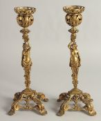 A GOOD PAIR OF ORMOLU CANDLESTICKS, ROCOCCO with classical female figure. 12ins high.