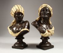 A VERY GOOD PAIR OF NORTH AFRICAN POTTERY BUSTS of a man and a young lady 12ins high.