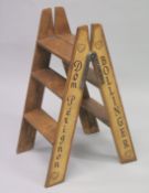 A PAIR OF NOVELTY PINE CHAMPAGNE STEPS. 34ins high.