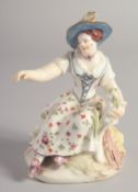 A BOW FIGURE OF SUMMER modelled as a girl, on a mound base.