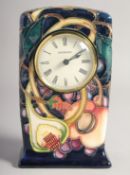 A MOORCROFT PORCELAIN CLOCK dated 2000. 6ins high.