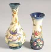 A SMALL MOORCROFT BULBOUS VASE by R. J. BISHOP, dated 2000, 6ins high and a small vase, J. W. '