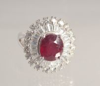 A SILVER AND RUBY COCKTAIL RING.
