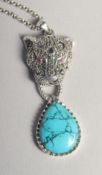 A SILVER MARCASITE RUBY EYE PANTHER PENDANT AND CHAIN.