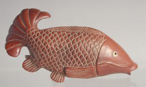 A CARVED WOOD CARP 5ins long.