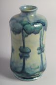 WILLIAM MOORCROFT FLORIAN WARE VASE, HAZELDENE DESIGN. Signed, W. Moorcroft in green. 5.75ins high.
