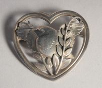 A GEORG JENSEN SILVER HEAD AND BIRD BROOCH. No. 239