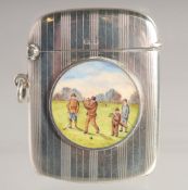 A GEORGE V ENGINE TURNED SILVER VESTA with a circular enamel plaque, two golf players and two