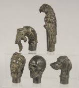 FIVE BRONZE WALKING STICK HANDLES.