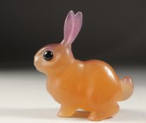 A DAUM TWO COLOUR GLASS RABBIT with black eyes. Signed: Daum, France. 5.5ins.