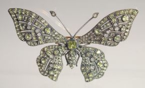 A LARGE SILVER AND GOLD PERIDOT AND DIAMOND BUTTERFLY BROOCH.