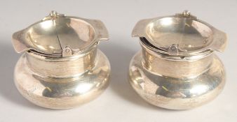 TWO SILVER CIRCULAR ASHTRAYS. 5.25ins diameter. Birmingham 1913.