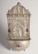 A CONTINENTAL SILVER WATER FONT set with cabochon stones. 8.1g