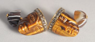 A GOOD PAIR OF RUSSIAN TIGERS EYE AND GOLD MASK CUFF LINKS set with diamonds. Marks; head, S.W. 56