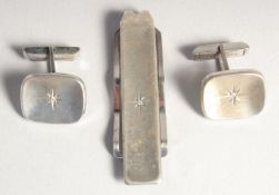 A PAIR OF SILVER CUFF LINKS AND TIE CLIP.