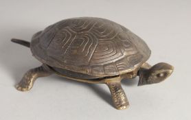 A BRONZE TORTOISESHELL DESK BELL. 6ins long.