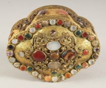 A GOOD CONTINENTAL GILT METAL, OVAL SHAPED JEWELL CASKET set with numerous agate and jade stones.