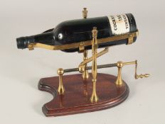 COCKBURNS VINTAGE PORT, 1963. Complete with screw operated pouring cradle.