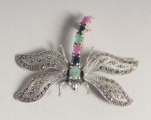 A SILVER RUBY, SAPPHIRE AND EMERALD MARCASITE DRAGONFLY BROOCH.