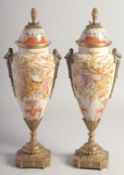 A PAIR OF TURQUOISE PORCELAIN AND BRONZE URN SHAPED VASES AND COVERS, decorated with musical