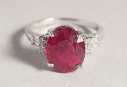 A SILVER AND RUBY RING.