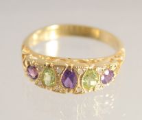 A SILVER GOLD PLATED AMETHYST, PERIDOT AND DIAMOND RING.