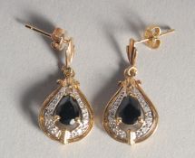 A PAIR OF GOLD SAPPHIRE AND DIAMOND EARRINGS.