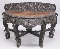A 19TH CENTURY BURMESE CARVED HARDWOOD DEMI-LUME CONSOLE TABLE, with carved and pierced upstand