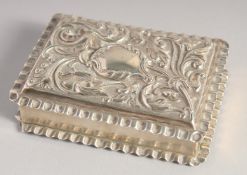 A VICTORIAN RECTANGULAR SILVER BOX with repousse top. 3.25ins x 2.25ins. Birmingham 1898.