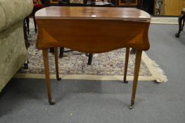 A pretty inlaid mahogany butterfly pembroke table.